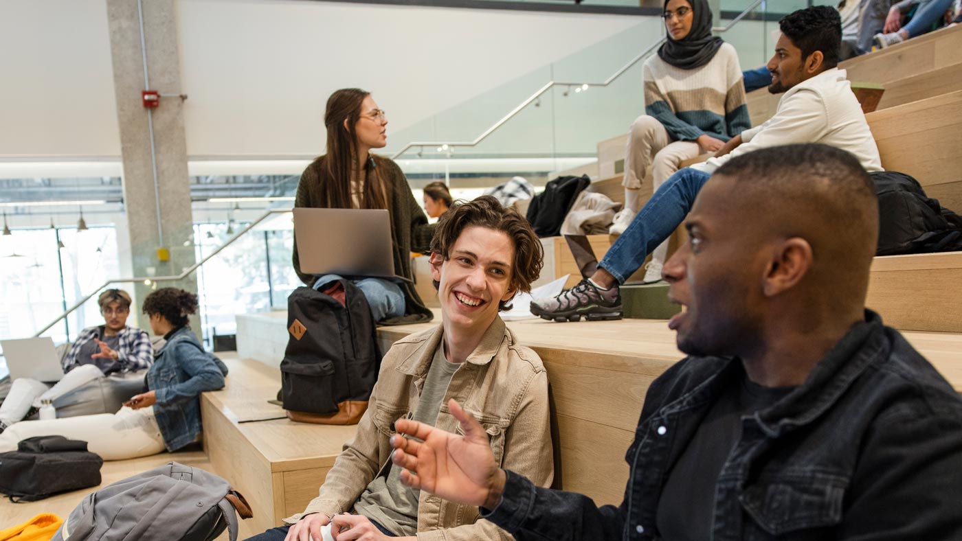 Students gathered on the stairs in CAB